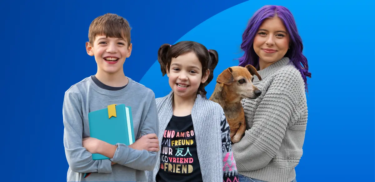 Student holding a book, girl smiling and student holding a dog