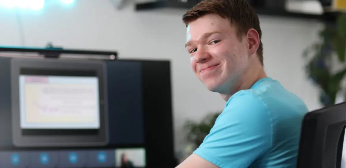 Student smiling at the camera